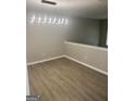 Dining area with modern light fixture and wood-look flooring at 2033 Oak Park Ln, Decatur, GA 30032