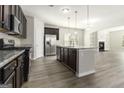 Modern kitchen with dark cabinets and island at 3967 Otter Dam Ct, Atlanta, GA 30349