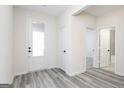 Bright entryway with luxury vinyl plank flooring, leading to the bedrooms and bathroom at 3382 Arabian Farm Ln, Dacula, GA 30019