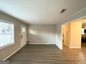 Spacious living room with hardwood floors and access to kitchen at 10214 Allen Sw Dr, Covington, GA 30014