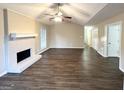 Spacious living room featuring a fireplace and vinyl plank flooring at 1641 Ne Riverchase Ln, Conyers, GA 30013