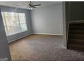 Spacious living room with neutral carpeting and large windows at 2395 Brianna Dr, Hampton, GA 30228