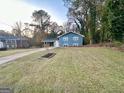 Blue house with a yard at 2803 Norgate Ln, Decatur, GA 30034