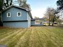 Back of house with partial view of yard at 2803 Norgate Ln, Decatur, GA 30034