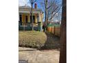 Side view of the house, showing the backyard and wooden fence at 1786 Lakewood Se Ave, Atlanta, GA 30315