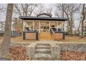 Modern lake house with large deck and stone steps at 480 Mitchell Rd, Covington, GA 30014