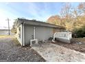 Gray exterior, boarded windows, and small deck at 2252 Brannen Se Rd, Atlanta, GA 30316
