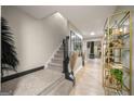 Elegant entryway with a carpeted staircase and modern shelving at 4197 Arnolds Mill Opas, Douglasville, GA 30135