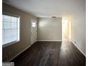 Bright living room featuring dark laminate flooring and neutral walls at 2749 Williamsburg Dr, Decatur, GA 30034