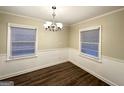 Simple dining room with hardwood floors and a chandelier at 2816 Cloverhurst Dr, East Point, GA 30344