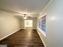 Bright living room with hardwood floors and view into dining area at 2816 Cloverhurst Dr, East Point, GA 30344