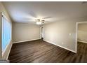 Bright living room with hardwood floors and neutral walls at 3029 Mckenzie Rd, East Point, GA 30344