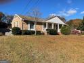 Ranch house with a large yard and mature trees at 6099 Winview Dr, Forest Park, GA 30297