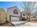 Two-story house with a brick and siding exterior, attached garage, and landscaping at 4626 Derby Loop, Fairburn, GA 30213