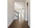 Hardwood floors and staircase leading to upper level at 613 Cork St, Woodstock, GA 30188