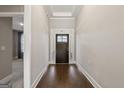 View of front door from interior hallway at 613 Cork St, Woodstock, GA 30188