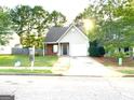 Cozy one-story house with a spacious driveway and well-maintained lawn at 261 Coral Cir, Mcdonough, GA 30253