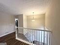 View of a staircase leading to the upper level with hardwood floors at 4436 Malibu Dr, Decatur, GA 30035