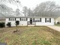 Newly painted Ranch home with a welcoming front porch and landscaping at 10178 Allen Sw Dr, Covington, GA 30014