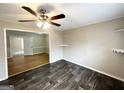 Bright living room with hardwood floors and a view into an adjacent room at 10178 Allen Sw Dr, Covington, GA 30014