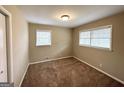 Bright bedroom with neutral walls, plush carpeting, and ample natural light at 3975 Phylis Pl, Decatur, GA 30035