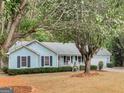 Ranch style home with a covered porch and large yard at 220 Melrose Way, Mcdonough, GA 30252