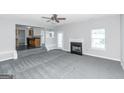 Living room with fireplace and view into kitchen at 30 Capeton Ct, Covington, GA 30016