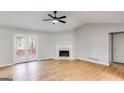 Living room with hardwood floors, fireplace and access to deck at 5488 Britton Dr, Villa Rica, GA 30180