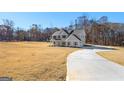 Two-story house with a long driveway and a spacious yard at 278 Deer Creek Run # 3-12, Moreland, GA 30259