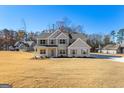 Two-story house with gray siding, white brick, and a large yard at 278 Deer Creek Run # 3-12, Moreland, GA 30259