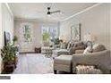 Relaxing living room, hardwood floors, ceiling fan, and plenty of natural light at 5158 Noble Village Way # 35, Lilburn, GA 30047