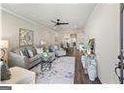 Spacious living room featuring hardwood floors and ample natural light at 5158 Noble Village Way # 35, Lilburn, GA 30047