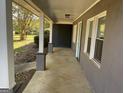 Front porch with gray painted walls and white trim, light blue door visible at 361 Almon Rd, Covington, GA 30014