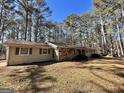 Ranch style home with stone accents and mature trees at 779 Dial Mill Rd, Oxford, GA 30054
