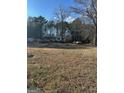 Single-story home with carport and spacious yard at 320 W Grantville Rd, Grantville, GA 30220