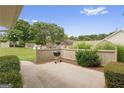 Outdoor patio space with a grill and privacy fencing, perfect for entertaining at 24105 Harvest Ridge Ln # 24, Alpharetta, GA 30022