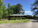 Brick ranch house with carport and mature trees at 1623 Highway 54 W, Fayetteville, GA 30214