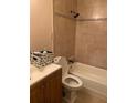 Bathroom with shower/tub combo and tiled walls at 3806 London Dr, Decatur, GA 30032