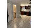 Kitchen and adjacent bathroom with tile floors at 3806 London Dr, Decatur, GA 30032
