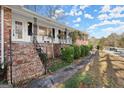 Brick ranch home, side view with steps and landscaping at 3330 Sw Pamlico Dr, Atlanta, GA 30331