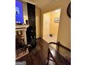 Living room with dark wood floors, fireplace, and entryway at 3000 Parc Lorraine, Lithonia, GA 30038