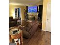 Spacious living room with fireplace, wood floors, and french doors at 3000 Parc Lorraine, Lithonia, GA 30038