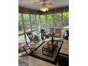 Bright sunroom boasts ample natural light and comfortable seating area at 2088 Noah'S Ark Rd, Jonesboro, GA 30236