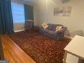Cozy living room featuring hardwood floors and a comfortable sofa at 1193 Clifton Rd, Atlanta, GA 30307
