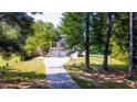 Two-story house with a three-car garage and a large backyard at 6277 N Sweetwater Rd, Lithia Springs, GA 30122