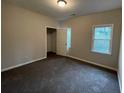Simple bedroom with carpet, window and a closet at 3541 Gleneagles Ct, Snellville, GA 30039