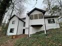 Two-story house with white exterior and deck at 3541 Gleneagles Ct, Snellville, GA 30039