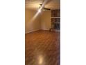 Spacious living room with hardwood floors and stone fireplace at 650 Lowell Sw Dr, Marietta, GA 30008