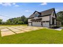 Three-car garage with modern design and landscaping at 604 N Van Wert N Rd, Villa Rica, GA 30180