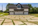 Three-car garage with unique paver driveway at 604 N Van Wert N Rd, Villa Rica, GA 30180